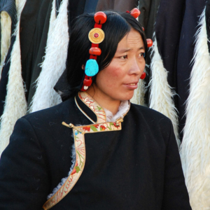 A Tibetan woman sells yak fleece overcoats in Lhasa. (Photo: Naomi Hellmann)