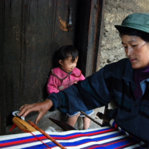 Blanket weaving in Qiunatong, Nujiang, Yunnan. Cotton string is purchased from a county market several hours away. (Photo: Naomi Hellmann)