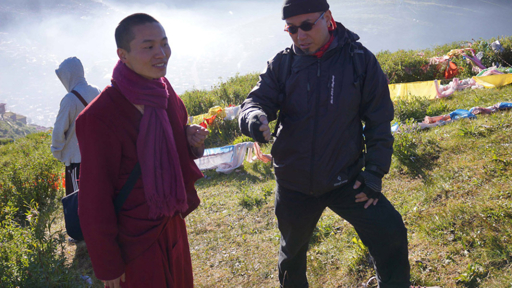 Dan Smyer Yu converses with a monk, a former modern dancer from Beijing, at Tibetan location. (Photo: Dan Smyer Yu)