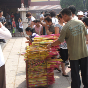 Prohibited from burning incense outside certain temple halls, devotees place their incense sticks in large containers.  At the Bailin Monastery in Hebei province, China. (Photo: Gareth Fisher)