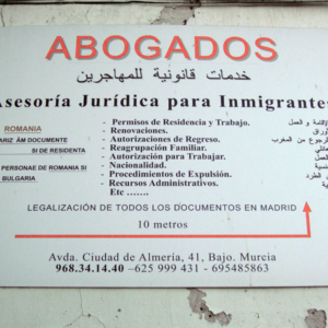 Multi-lingual sign. Lawyers and legal advice for immigrants, Murcia, Spain. (Photo: Damian Omar Martinez)