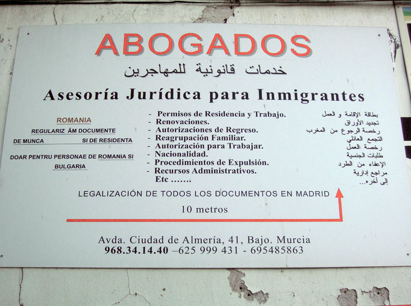 Multi-lingual sign. Lawyers and legal advice for immigrants, Murcia, Spain. (Photo: Damian Omar Martinez)