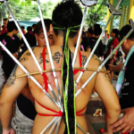 Extreme body piercing by a spirit medium channelling the Underworld deity Di Ya Pek (Photo: Fabian Graham)