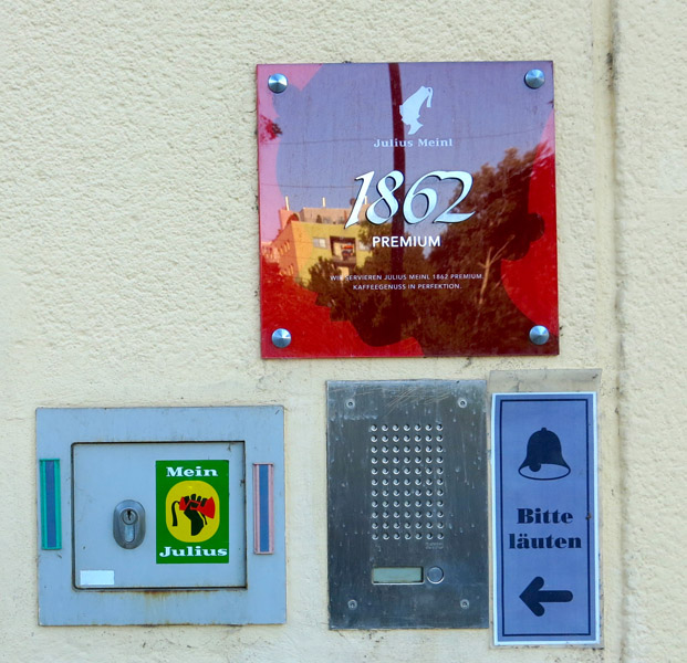 Entrance to the Julius Meinl company in Julius-Meinl-Gasse, which became one of the most important coffee manufacturer and retailer during the Habsburg Monarchy. A sticker of the initiative “Mein Julius” ('My Julius') challenges the racial stereotypes of the company's logo depicting a black child servant wearing a fez. (Photo: Annika Kirbis)