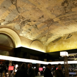 Café Urbanis. On the way from Piazza Borsa to Piazza Unità, there is another historical café, the Urbanis. Opened in 1832, during the latest renovation works, an original fresco was uncovered (in the picture). It’s frequented mostly in the evening for its cocktails and aperitifs. (Photo: Giulia Carabelli)