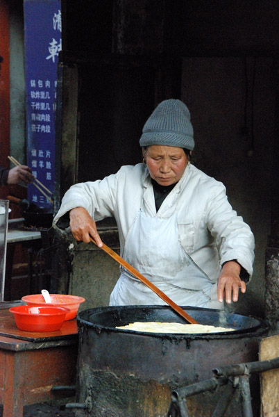 Making jianbing, a Chinese style egg and scallion pancake, in Harbin in northeastern China. (Photo: Naomi Hellmann)