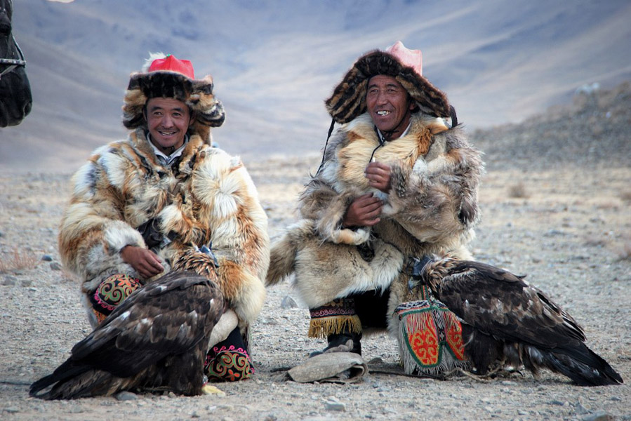 Kazakh eagle hunters relax at the Golden Eagle Festival in Bayan Ulgii, western Mongolia. (Photo: Naomi Hellmann)