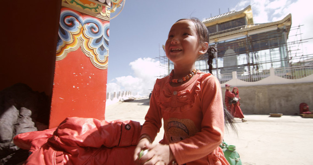 A young pilgrim in a Tibetan location. (Photo: Dan Smyer Yu)