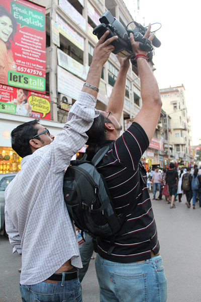 Amaresh and Prakash making a shot of a busy street. (Photo: Annelies Kusters)