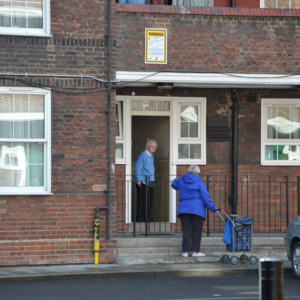 Two elderly residents chatting in front of their council flats. (Photo: Doerte Engelkes)