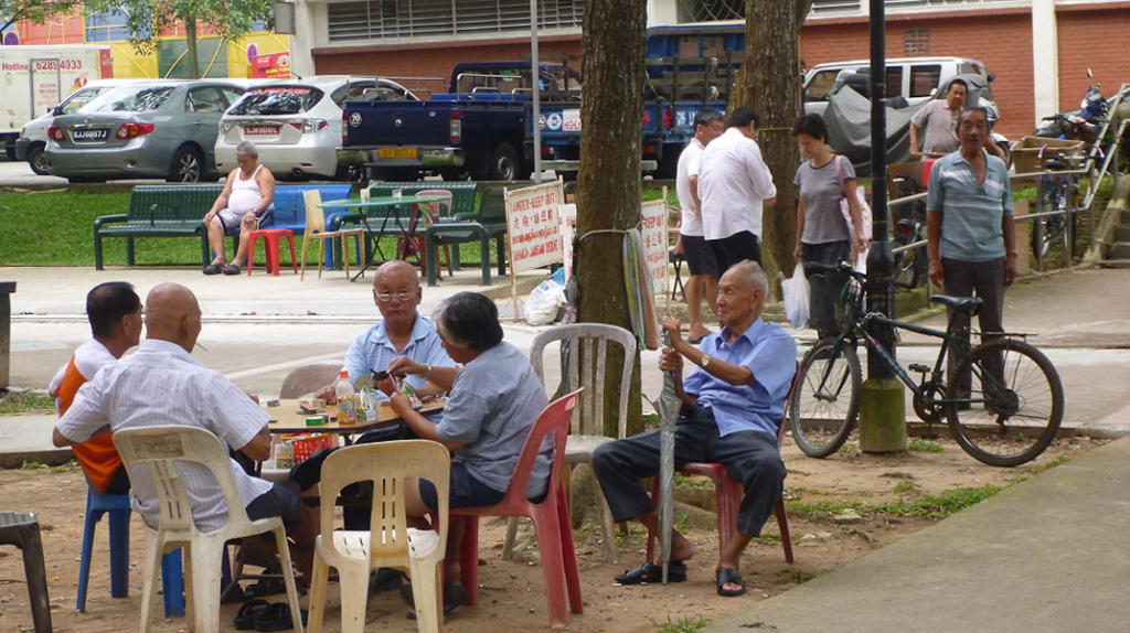 Senior men gather every day at this corner along a public pathway connecting the market, hawker center and public housing to gamble, chit-chat or to just to look. (Photo: Junjia Ye)