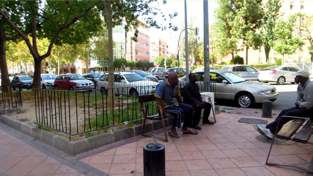 Chatting in the square II [Freeze-frame], Murcia, Spain. (Photo: Damian Omar Martinez)