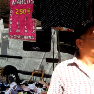 Street market VI. Evangelist street preacher [Freeze-frame], Murcia, Spain. (Photo: Damian Omar Martinez)