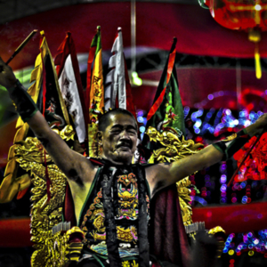Singapore – Spirit medium channelling the warrior deity Fa Zhu Gong being carried in a sedan chair at the opening ceremony of the Ang Mo Kio United Temple. (Photo: Fabian Graham)