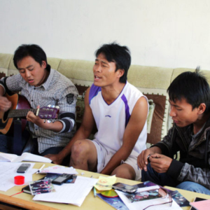 Youth singing Lisu Christian pop (mutgguat ssat) while playing the guitar, Baihualing Church, Lushui County, 29 November 2012. (Photo: Ying Diao)