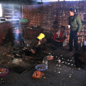 Lisu family sitting around the fireplace (ggutzul in Lisu, huotang in Chinese), 20 December 2012. (Photo: Ying Diao)