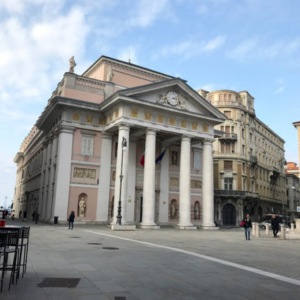 Piazza della Borsa. Few meters away, the Commodity Exchange (Italian: Borsa Merci) was funded in 1755 by Maria Theresia and it is the oldest in the world. Besides being the historical financial centre of the city, the square is also considered one of its most important meeting places. (Photo: Giulia Carabelli)