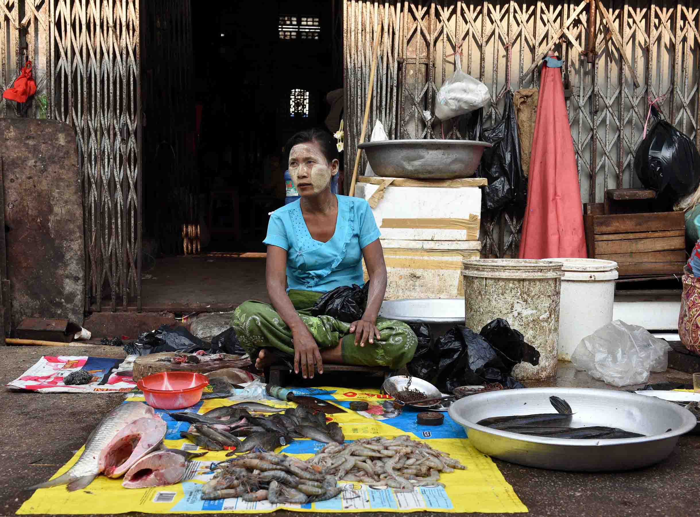 A fish monger waiting eagerly for customers. (Photo: Naomi Hellmann)